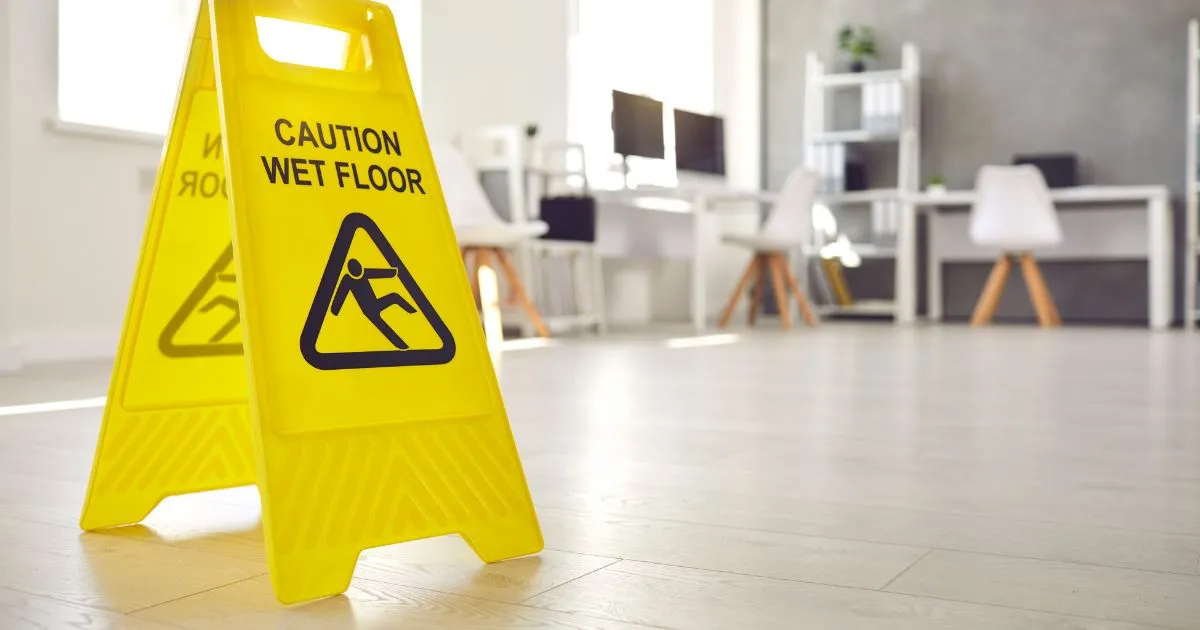 caution wet floor sign on the ground